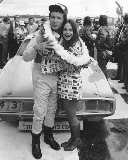 Richard Petty celebrates with Miss Winston.