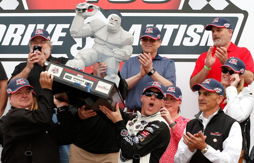 Kevin Harvick and crew hold up race winning trophy