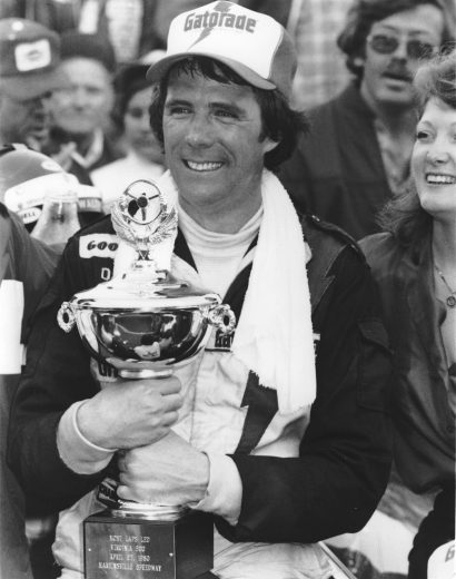 Darrell Waltrip poses with trophy in Victory Lane.