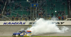 Christian Eckes does a burnout at Kansas Speedway.