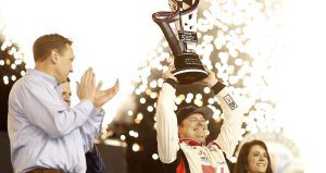 Cole Custer lifts Xfinity Series championship trophy.
