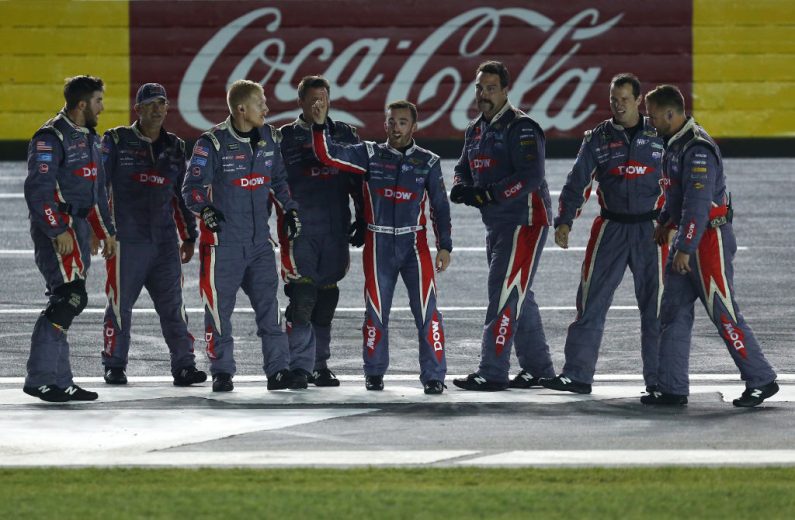 Austin Dillon celebrates with his team after winning at Charlotte.