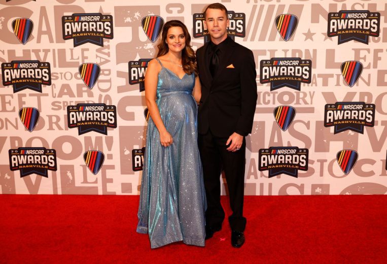 Ben Rhodes and wife, Caitlynn Rhodes pose for photos on the red carpet