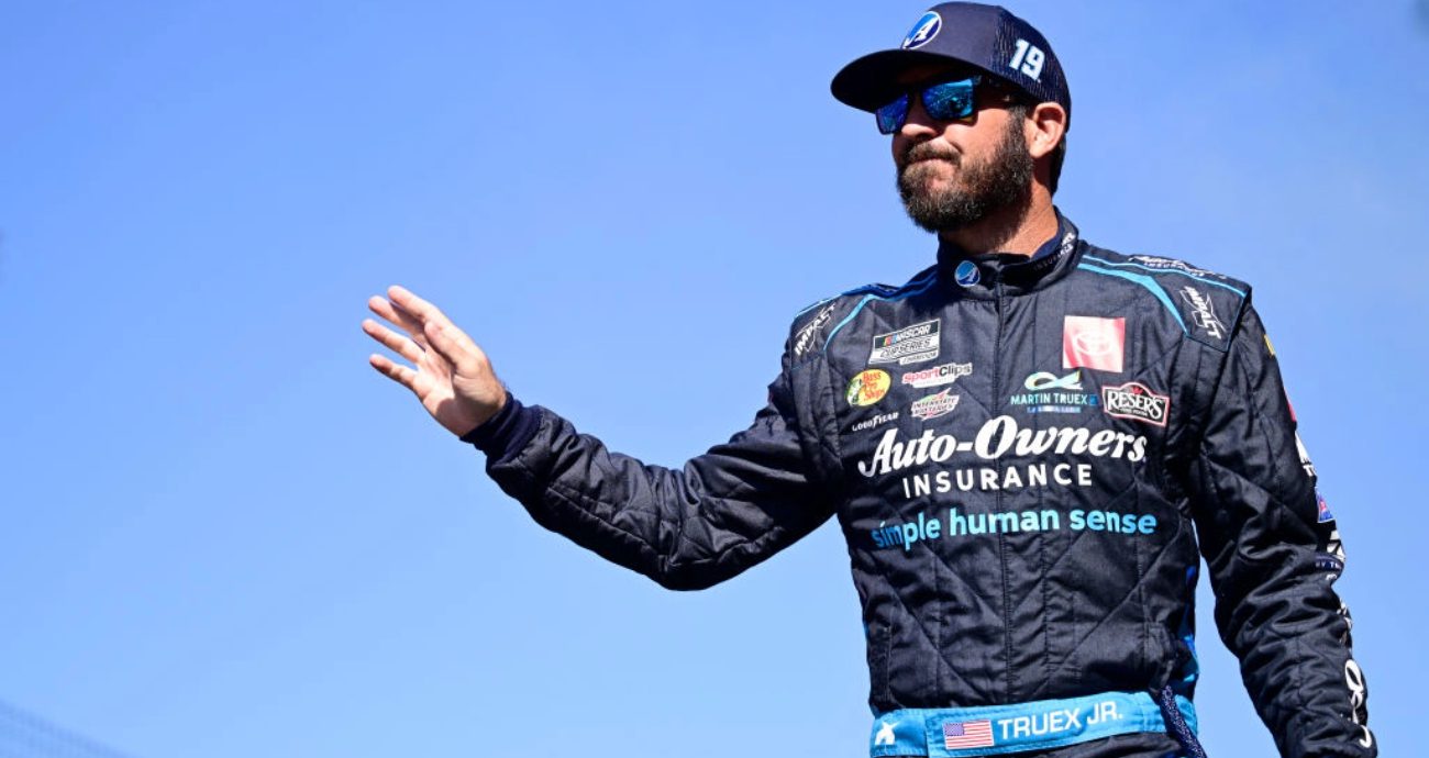 Martin Truex Jr. looks on.