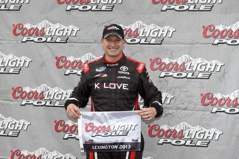 Michael McDowell celebrates after winning the pole at Mid-Ohio.