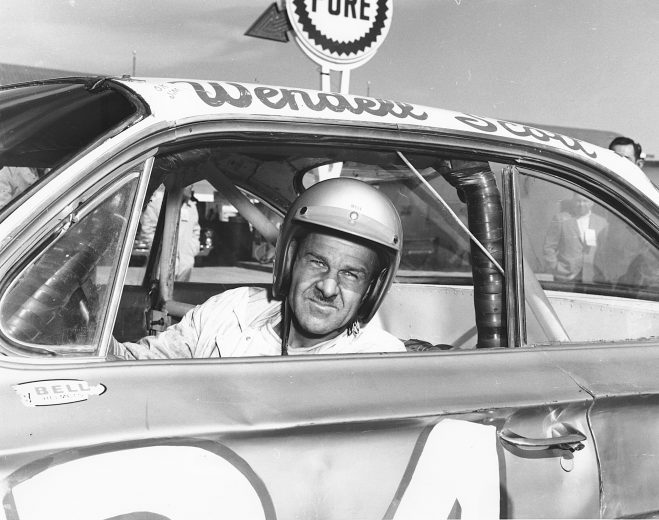 Wendell Scott poses for a portrait in his car.