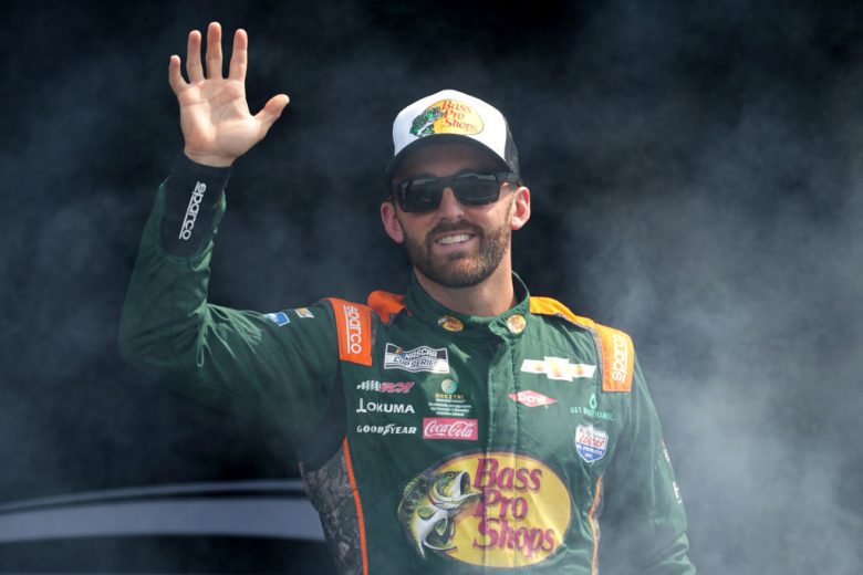 Austin Dillon waves to fans.