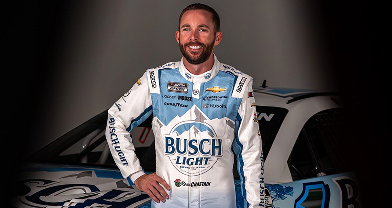 Ross Chastain posing in fire suit