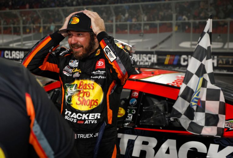 Martin Truex Jr. celebrates after winning in Los Angeles.