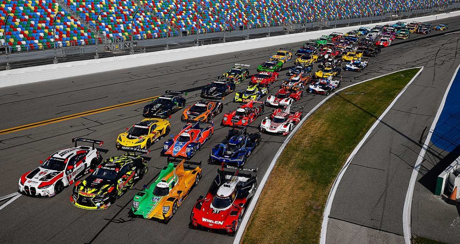 The full field for the IMSA Rolex 24 lines up for a group photo at Daytona International Speedway