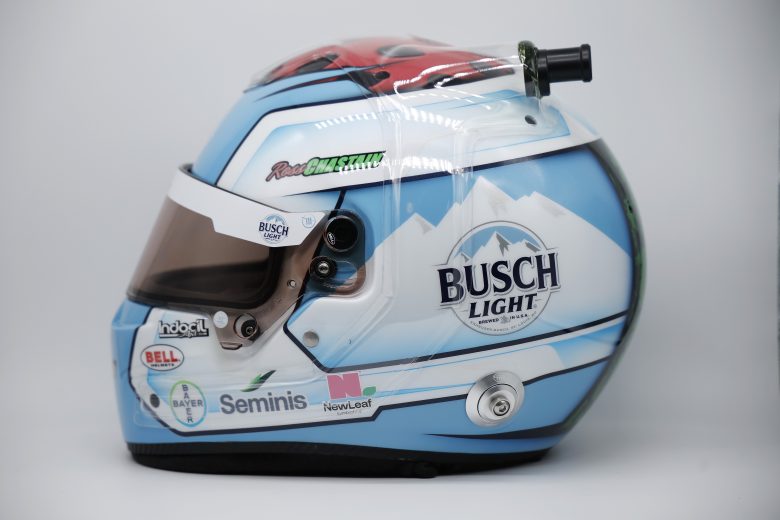 side profile view of Ross Chastain's baby blue and white racing helmet.