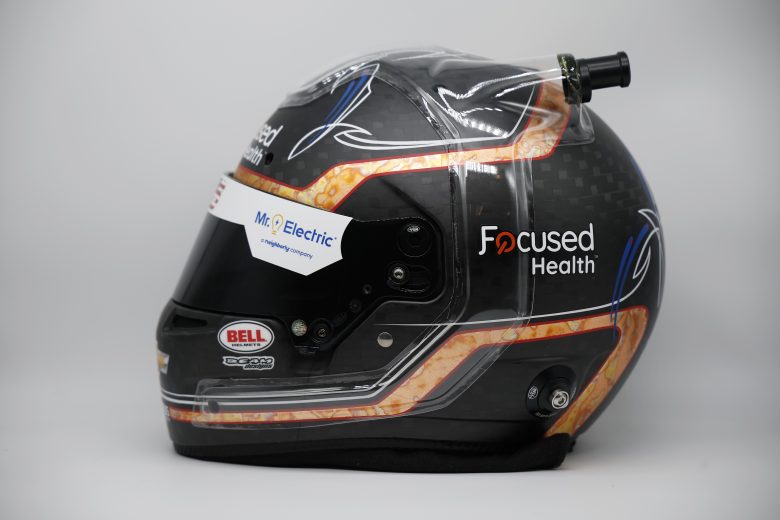 side profile view of Zane Smith's black and bronze racing helmet
