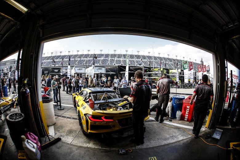 Corvette racing car exiting the garage area