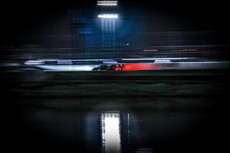 Porsche 963 GTP driving at night
