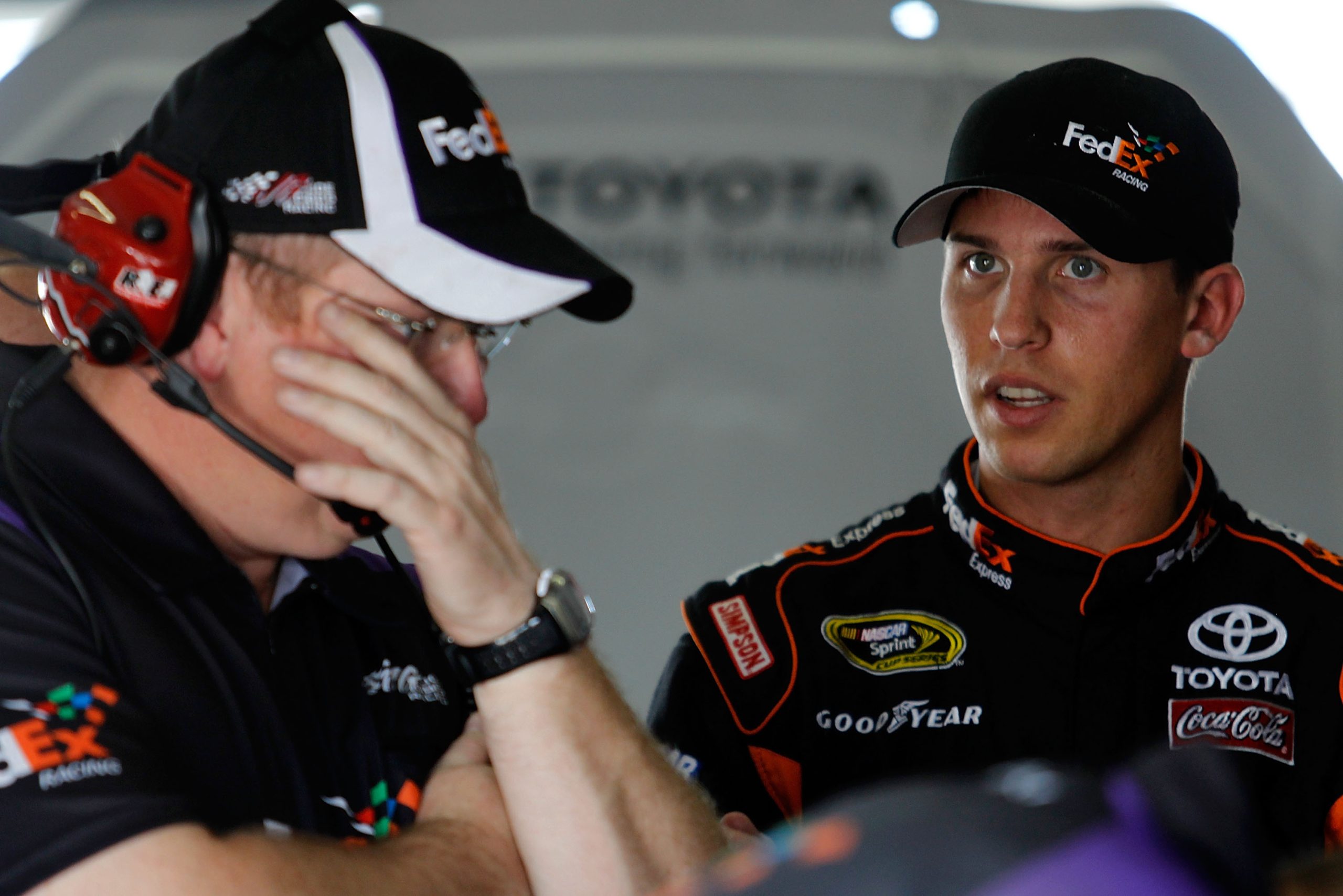 Denny Hamlin and Mike Ford speak in the garage ahead of the NASCAR Cup Series finale at Homestead-Miami Speedway.
