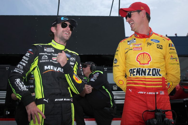Ryan Blaney, left, and Joey Logano, right, laugh before a NASCAR Cup Series race.