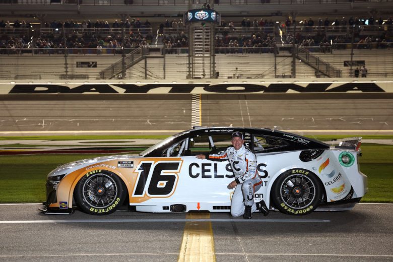 AJ Allmendinger poses next to his No. 16 Chevrolet at Daytona International Speedway.