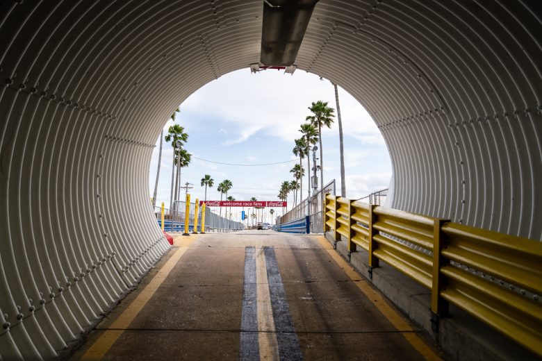 A view of walking out of the tunnel to the sunlight and entering the infield.