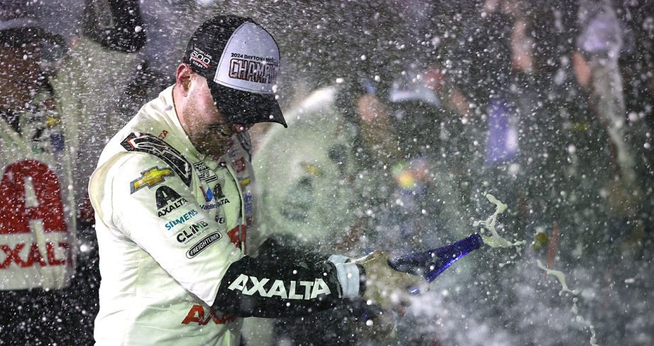 William Byron celebrates his Daytona 500 win by spraying champagne.
