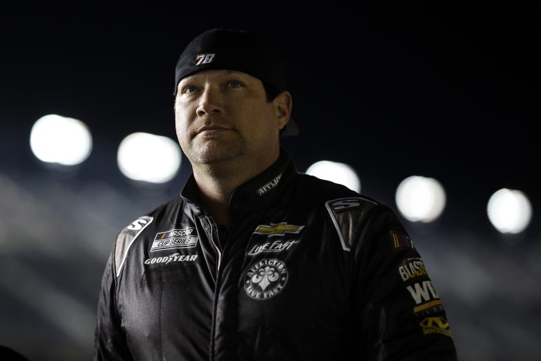 BJ McLeod, driver of the No. 78 Live Fast Motorsports Chevrolet, walks the grid during qualifying for the NASCAR Cup Series Daytona 500.