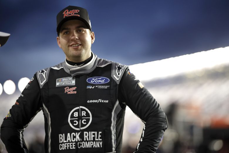 Noah Gragson, driver of the No. 10 Black Rifle Coffee/Ranger Boats Ford, looks on in the garage area during practice for the NASCAR Cup Series Daytona 500.