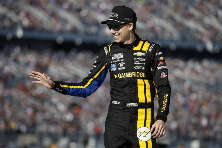 Carson Hocevar, driver of the No. 77 Gainbridge/Zeigler Auto Group Chevrolet, waves to fans as he walks onstage during driver intros prior to the NASCAR Cup Series Daytona 500.