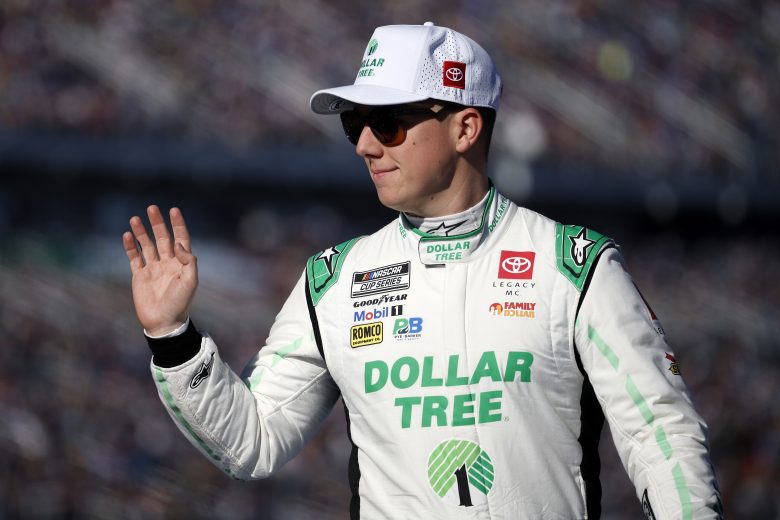 John H. Nemechek, driver of the No. 42 Dollar Tree Toyota, waves to fans as he walks onstage during driver intros prior to the NASCAR Cup Series Daytona 500.