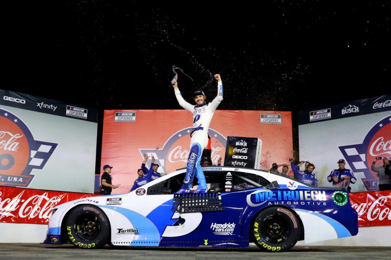 Kyle Larson celebrates in Victory Lane at Charlotte Motor Speedway.
