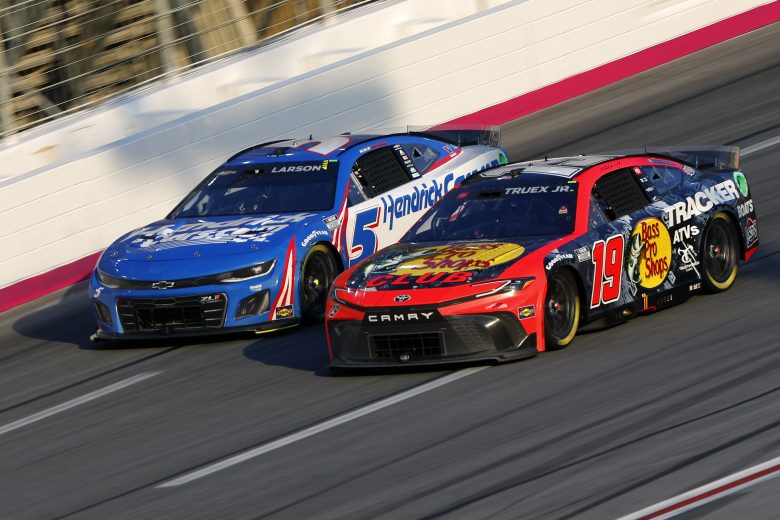 Martin Truex Jr. (19) and Kyle Larson (5) run side by side at Atlanta Motor Speedway