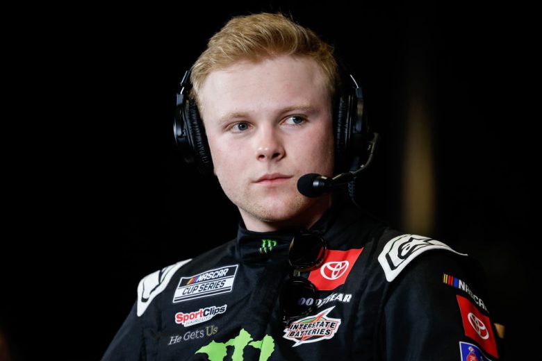 Ty Gibbs wears a headset and listens intently.