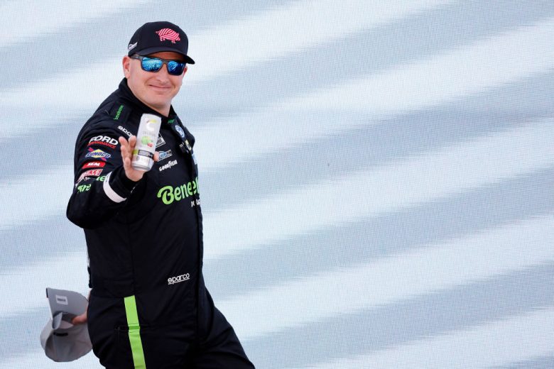Michael McDowell walks across the stage and waves to the crowd.
