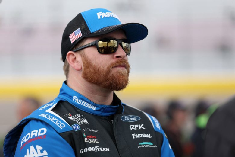 Chris Buescher looks on.