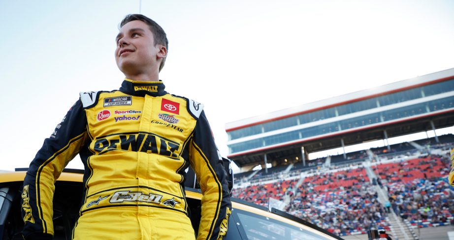 Christopher Bell stands next to his car before a NASCAR Cup Series race at Bristol Motor Speedway.