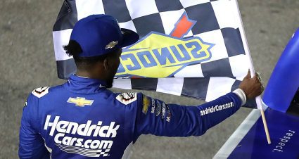 Rajah Caruth hold checkered flag