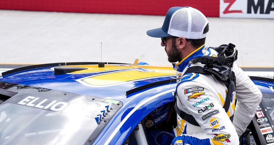Chase Elliott climbs into car