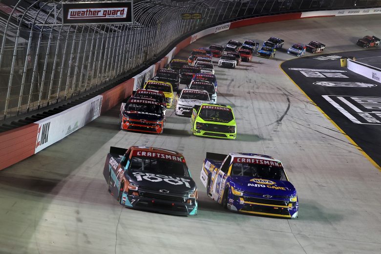 Christian Eckes and Kyle Busch battle for the lead at Bristol.