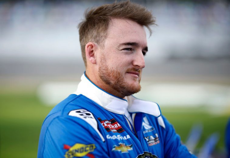 Ty Dillon looks on.