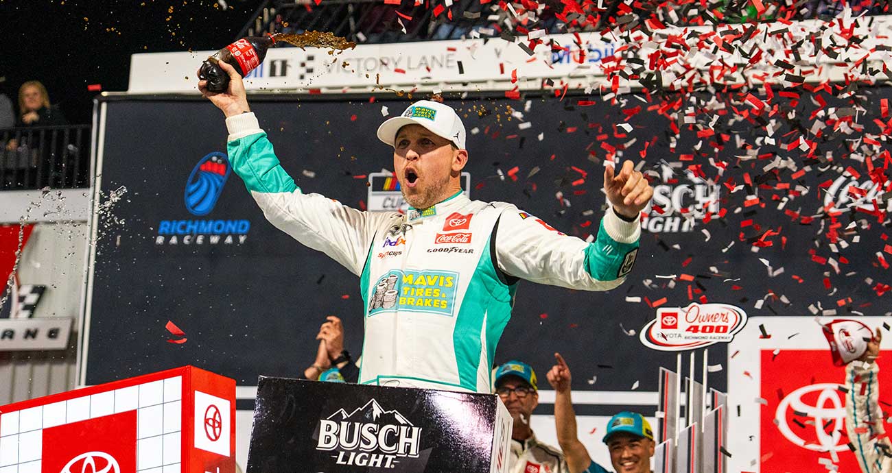 Denny Hamlin celebrates in Victory Lane at Richmond Raceway