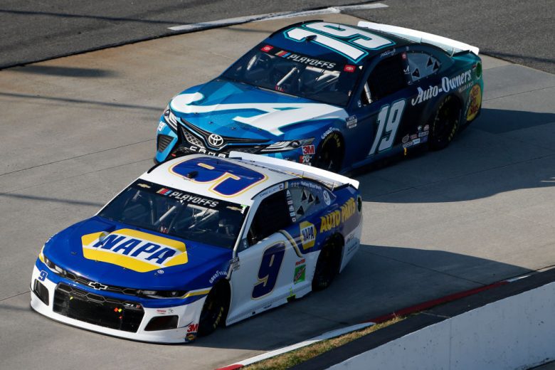 Chase Elliott, in the No. 9 Hendrick Motorsports Chevrolet. races ahead of Martin Truex Jr. in the No. 19 Joe Gibbs Racing Toyota at Martinsville Speedway.