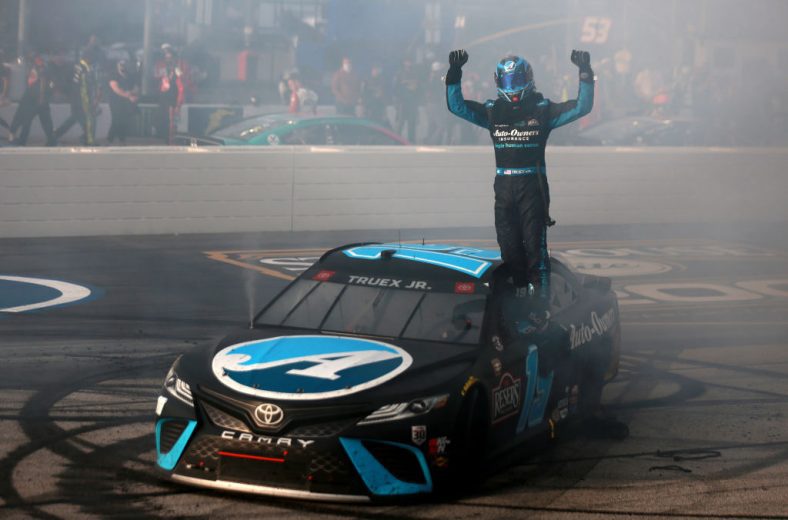 Martin Truex Jr. celebrates after winning at Darlington Raceway.