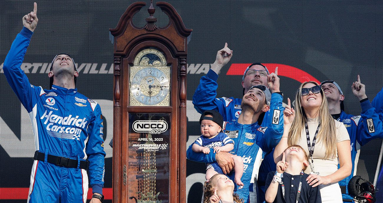 kyle larson celebrates in victory lane