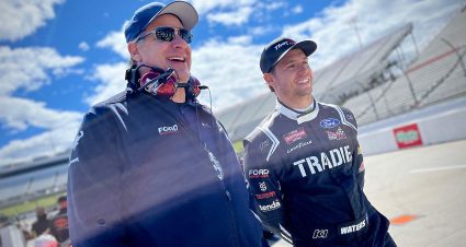 Cam Waters, right, shares a laugh with Pat DiMarco, NASCAR Program Manager for Ford Performance, on the Craftsman Truck Series grid at Martinsville Speedway