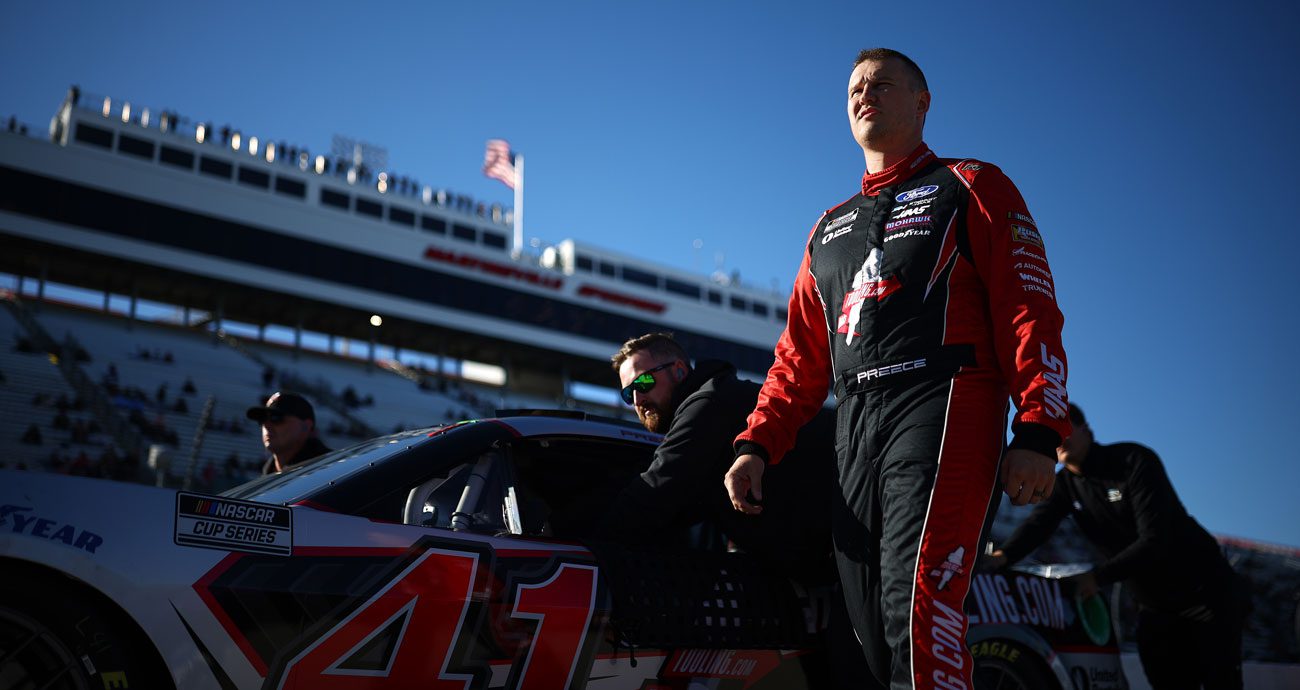 Ryan Prece stands next to his car during practice and qualifying at Martinsville Speedway.