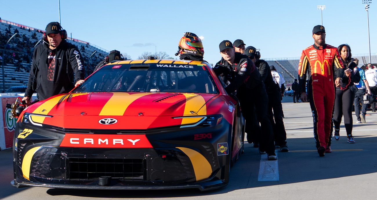 Bubba Wallace walks pit road at Martinsville Speedway.