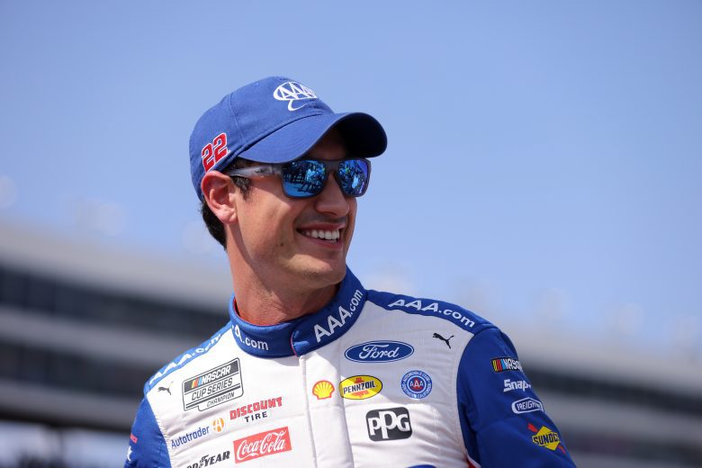 Logano looks on