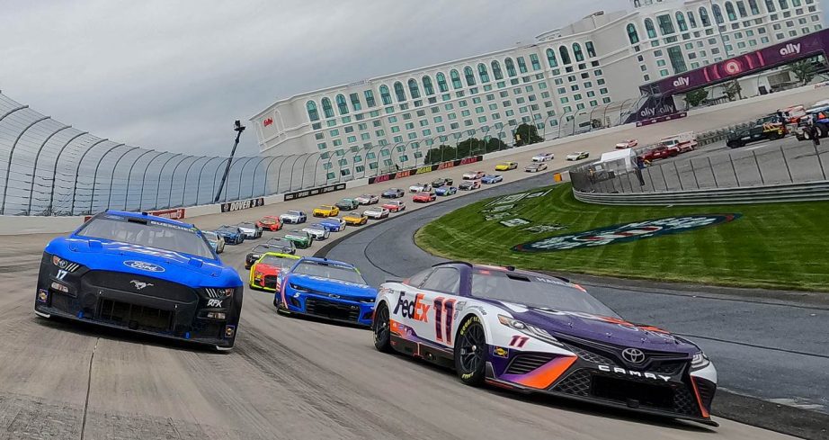 NASCAR Cup Series cars race at Dover Motor Speedway.