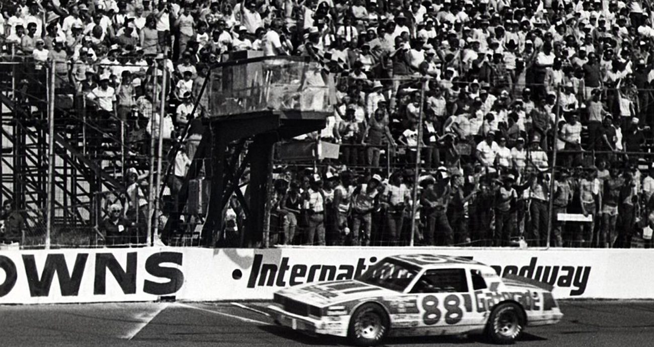 Bobby Allison takes the checkered flag