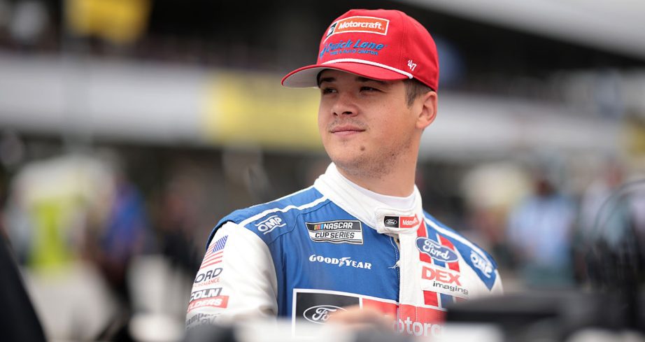 Harrison Burton stands on the grid