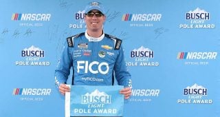Kyle Busch with the Busch Light Pole flag after his qualifying effort at Dover Motor Speedway
