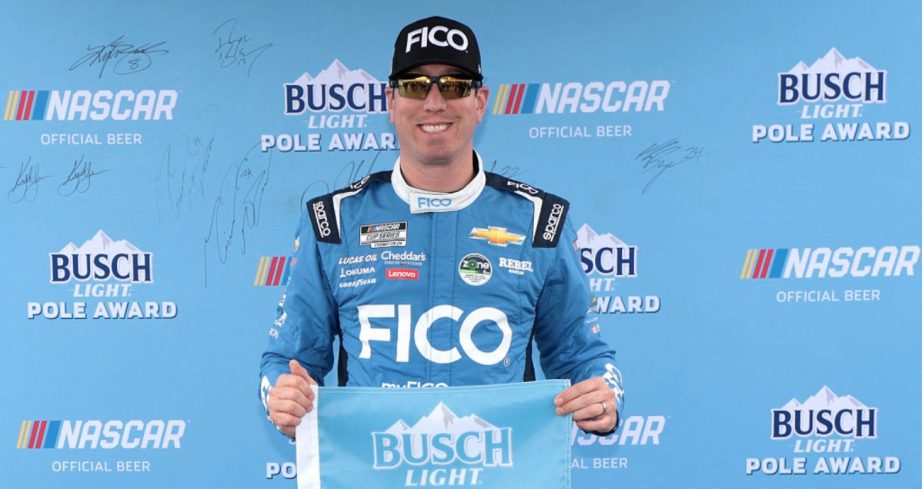 Kyle Busch celebrates after winning the pole at Dover.